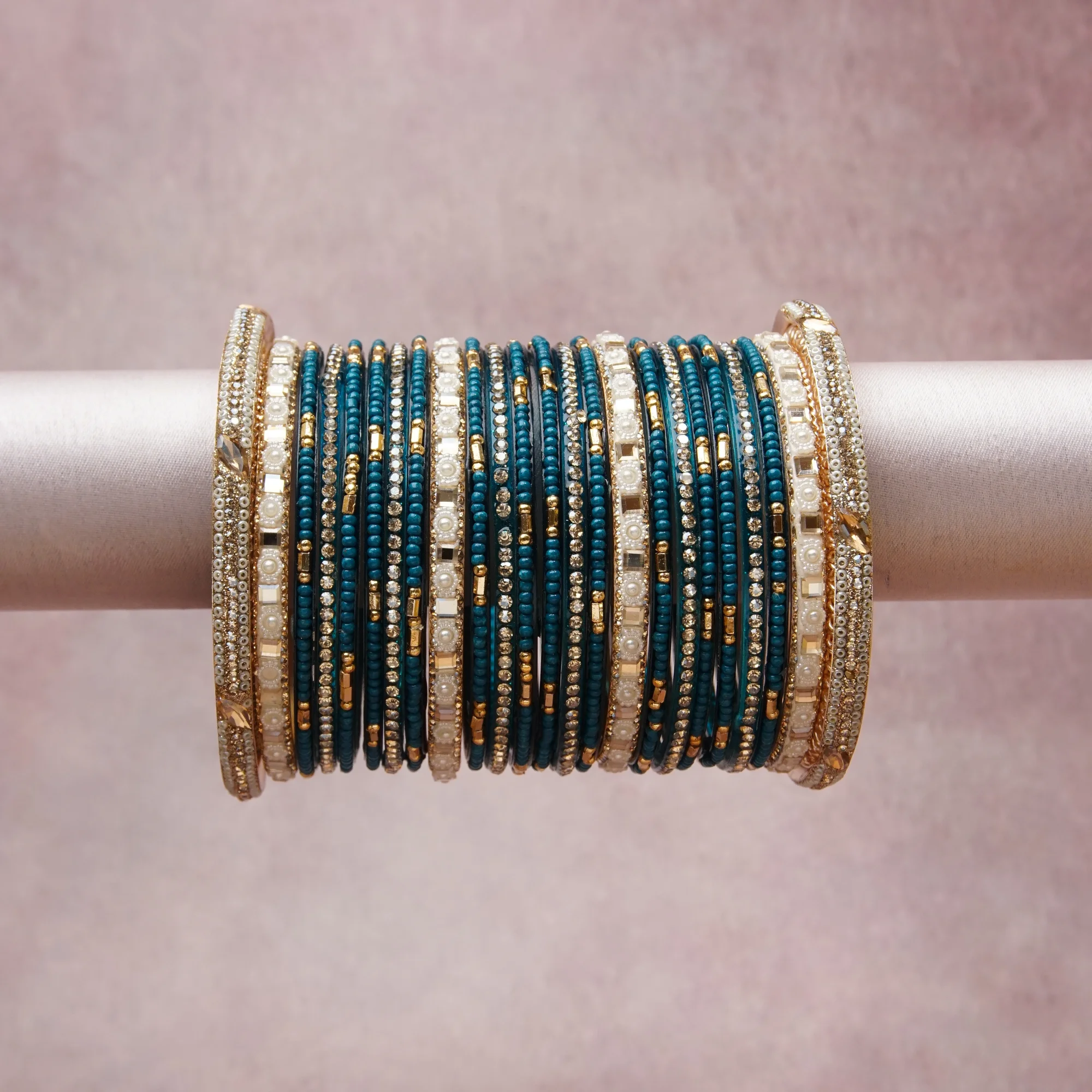 A grounding Teal forms the heart of the set, while touches of Gold, Ivory, Clear add charm.

A thoughtful composition of Glass Beads, Gold-Toned Metal, Simulated Pearls, Rhinestones, designed to feel complete without being heavy.
Each element layers seamlessly, creating a look that is refined, wearable and quietly striking.